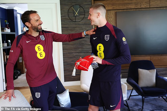 The midfielder was presented with his first cap by Three Lions boss Gareth Southgate on Tuesday