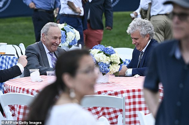 Biden briefly recognized Majority Leader Sen. Chuck Schumer (D-NY), seated with White House Chief of Staff Jeff Zients (R)