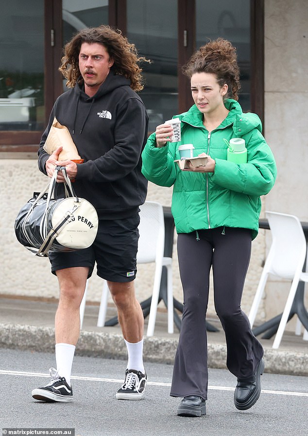 Abbie got comfy in a pair of chunky black boots and showed off her fresh-faced beauty as she went makeup-free for the outing