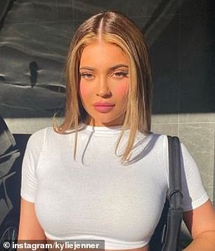 Kylie Jenner opted for a light blonde shade to team up with her asymmetrical dark brown hair