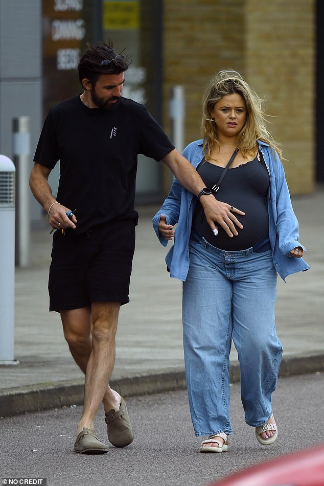 At one point, her partner graciously placed his hand on her stomach during their healthy walk