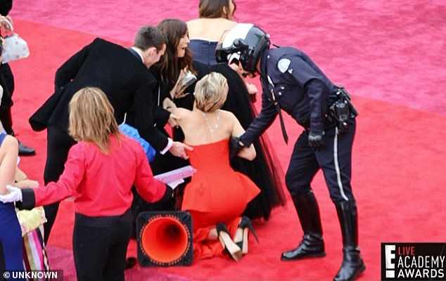 The actress previously tripped over her own dress while wearing heels at the 86th Annual Academy Awards in 2014 (pictured)