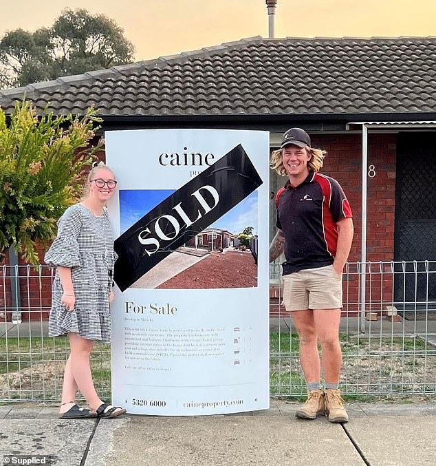 Mrs. McGuire had bought a house with Young just under a year before he allegedly killed her (the former couple pose outside the house)