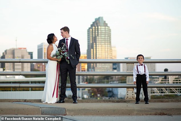 The driver was taken to hospital with minor injuries, but has not yet been arrested.  (photo: Tyler, Susan and Miles on their wedding day)