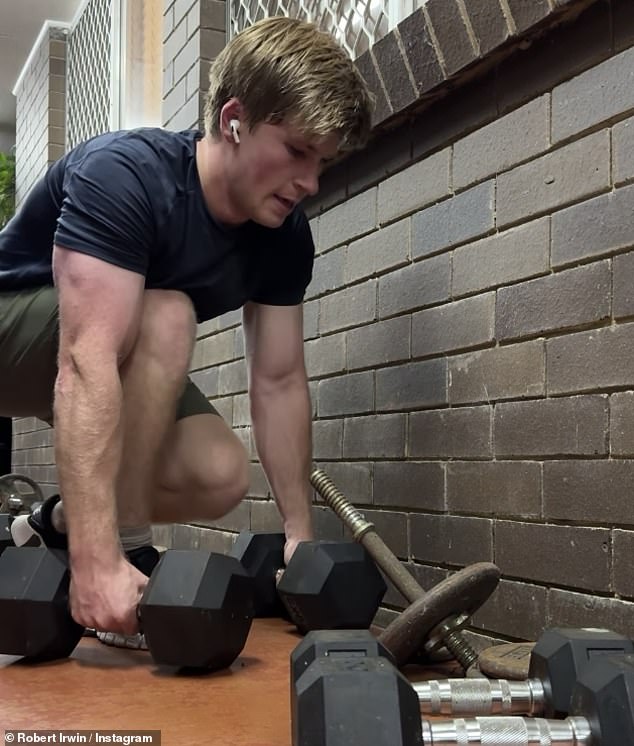 The famed conservationist, 20, posted to Instagram on Wednesday a video of himself exercising caution while lifting old weights in his home gym, revealing a huntsman spider.