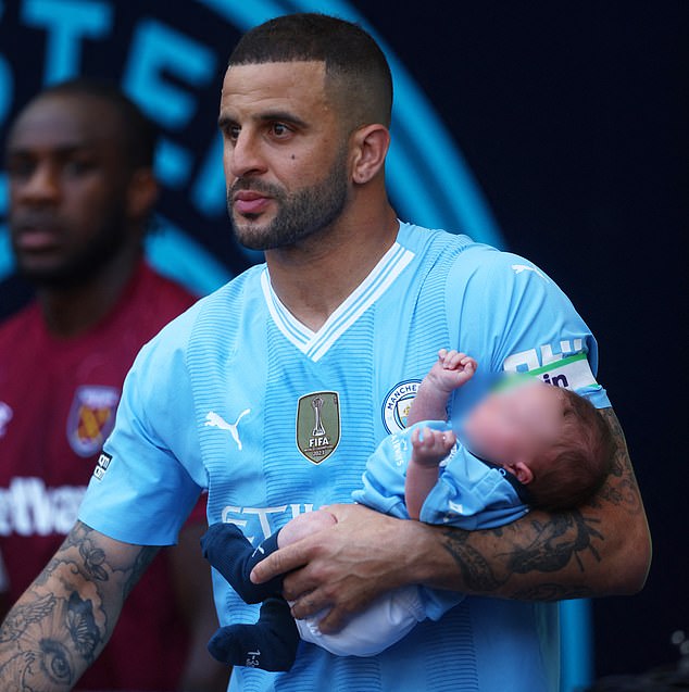 Manchester City footballer Walker with he and Annie's fourth child, Rezon, who was born in April