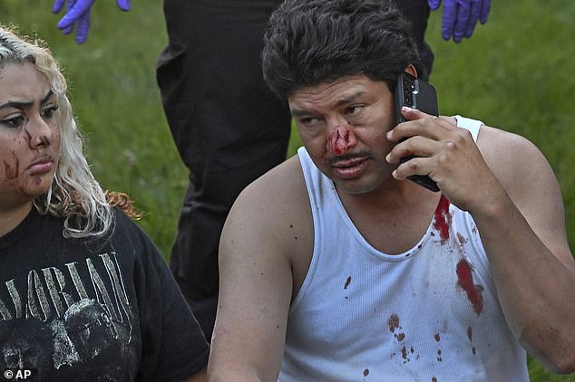 Injured tornado victims are moved to the front yard of a neighbor's house in Gaithersburg, Maryland