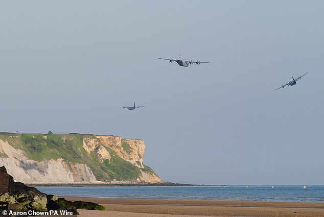 Planes fly over the beaches of Arromanches in Normandy