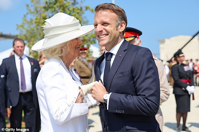 President Macron also put on a charming display when he squeezed Queen Camilla's hand