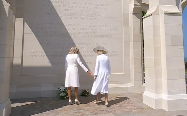 After placing their flowers at the British Normandy Memorial in Ver-sur-Mer, the First Lady contacted the Queen, but Camilla seemed somewhat reluctant to offer her gloved hand.