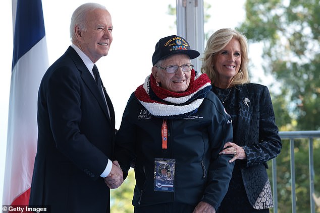 Biden presented vets with specially made coins to mark the occasion