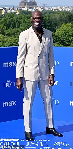 Steve looked stylish for the occasion in a light gray double-breasted suit, which he teamed with a dark shirt and black leather shoes.