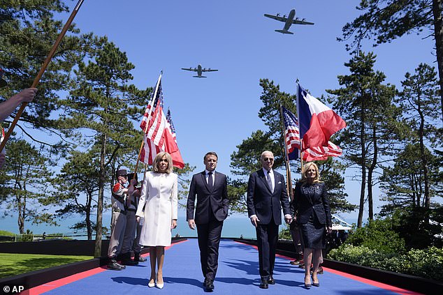 President Joe Biden, first lady Jill Biden, French President Emmanuel Macron and his wife Brigitte Macron walk on stage during ceremonies marking the 80th anniversary of D-Day