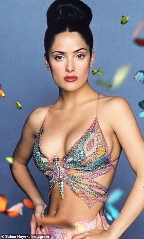 The star shared another photo of herself from the early years, wearing a bedazzled butterfly top, which showed off her abs, and a pink, purple and yellow wrap skirt.