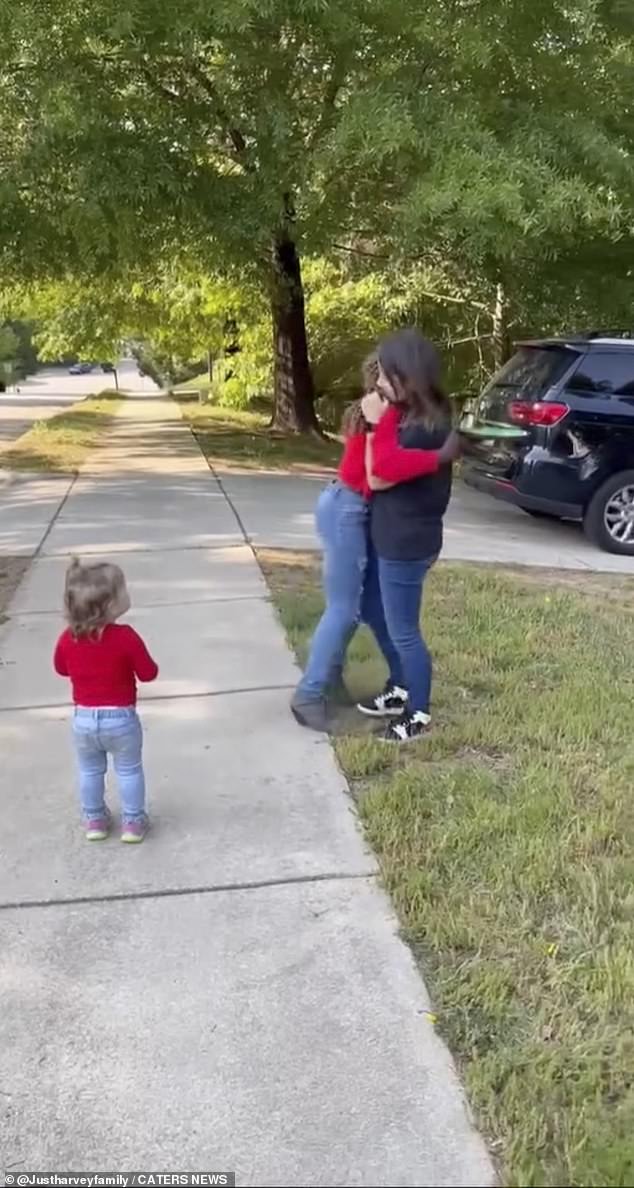 The little boy opens her mouth in shock and immediately pulls her adoptive mother in for a hug before bursting into tears