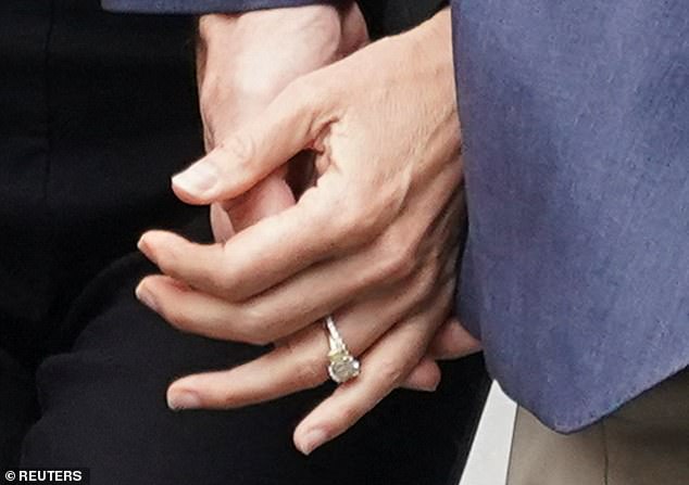 The president's daughter-in-law showed off two rings on her wedding finger as she arrived at court with her new husband