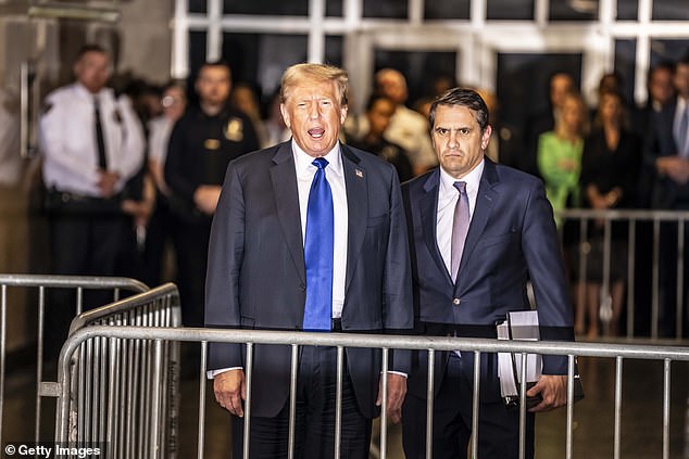 Former President Donald Trump (left) is pictured leaving court last Thursday after being convicted of all 34 charges in the hush money case.  Biden said the process was 