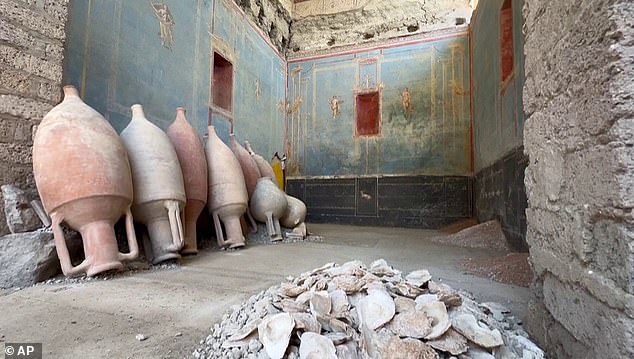 Researchers discovered fifteen jugs still propped up against the wall, oil lamps left in the area, and three decorative boxes nestled in the walls that likely contained devotional images.