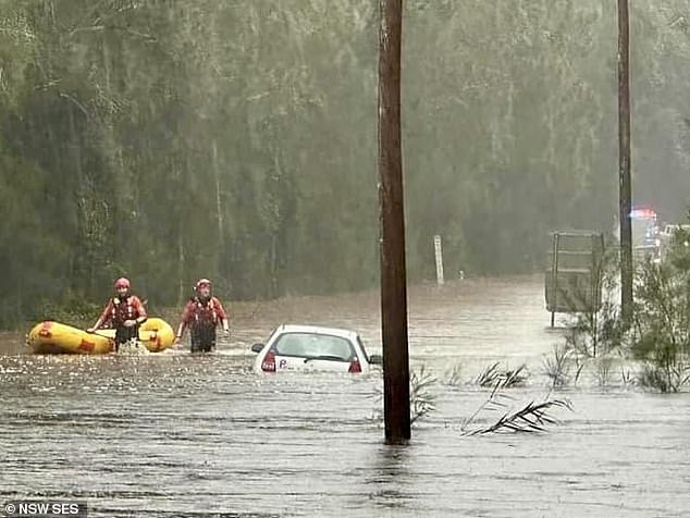 The rain bomb exploded over much of NSW on Thursday night, dumping more than 250mm of rain in parts of the Illawara and the state's south-east (Photo: SES rescuers in action)