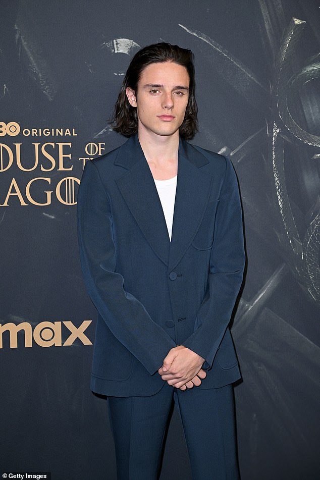 Harry Collett attended the Paris premiere in a navy blue suit