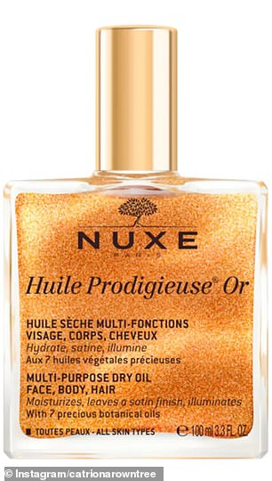 She picked up a bottle of NUXE Huile Prodigieuse Or, a luxurious shimmering oil for face, body or hair