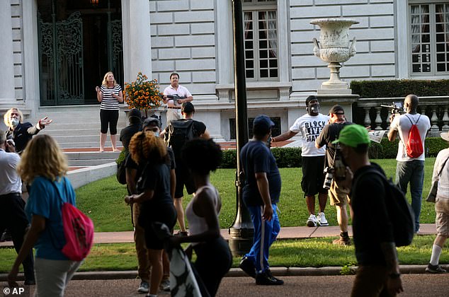 The McCloskeys became infamous when they were caught on camera emerging from their home in an upscale neighborhood waving firearms at protesters as they marched past