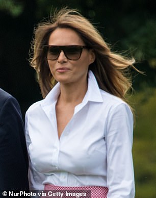 Melania opted for a white button-up during a trip to Trump National Golf Course in 2017.