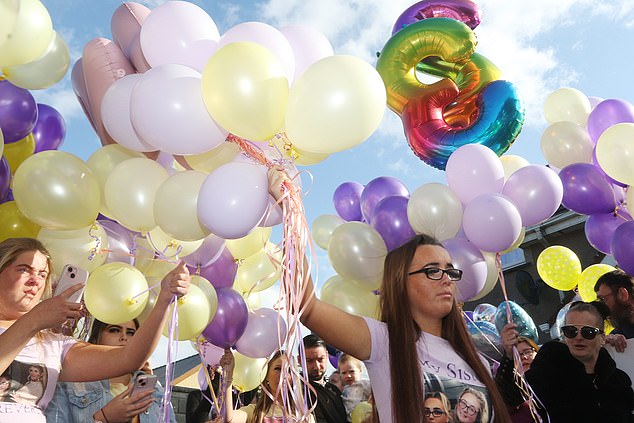 Ms Morey's sister, Jolene Morey, led the countdown at the vigil before hundreds of colored balloons went into the air and a selection of Ms Morey's favorite songs were played on a loudspeaker