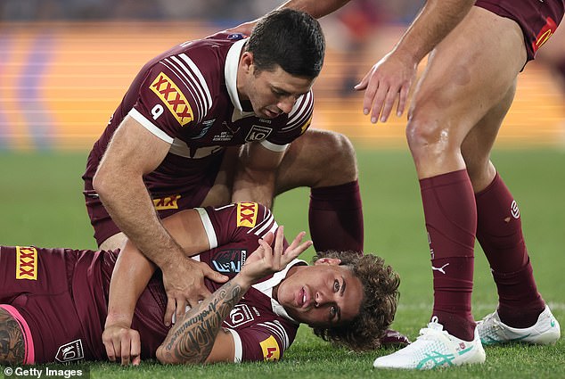 Walsh was taken out inside the first eight minutes of the State of Origin opener (pictured) when the Blues rookie center came out of line and hit him high and late.