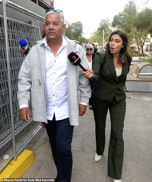 Roger Kerr, who is himself a former AFL player and coach, is seen leaving the field