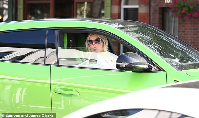 After four hours in the hairdresser's chair, Kerry jumped into her bright green £200,000 Lamborghini Urus 4x4, which was parked nearby