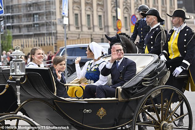 The beaming royal family was accompanied in the carriage by their youngest member, Prince Oscar, aged eight