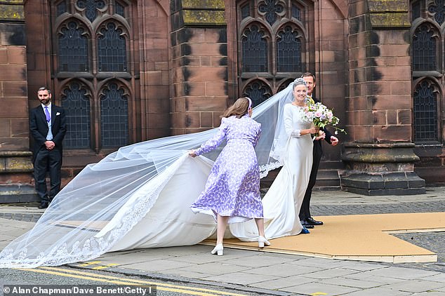 Bridge smiled in her wedding dress before walking into the cathedral to marry the Duke of Westminster