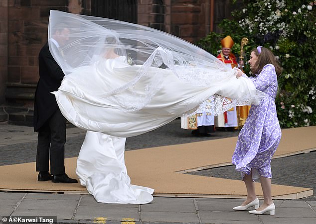 Olivia arrives at Chester Cathedral today for her wedding to the Duke of Westminster