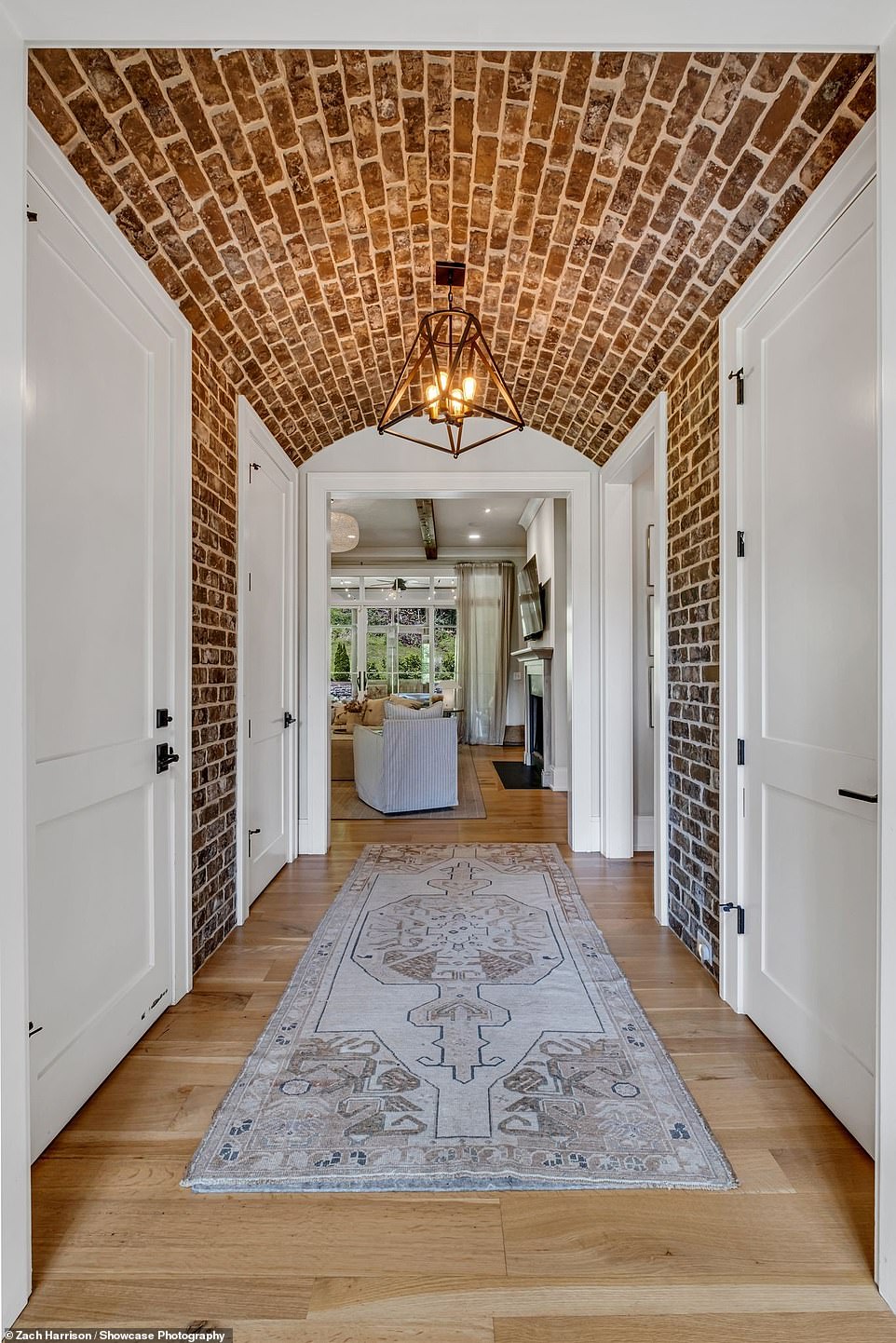 The hallway is brick, perfect for a farmhouse style home