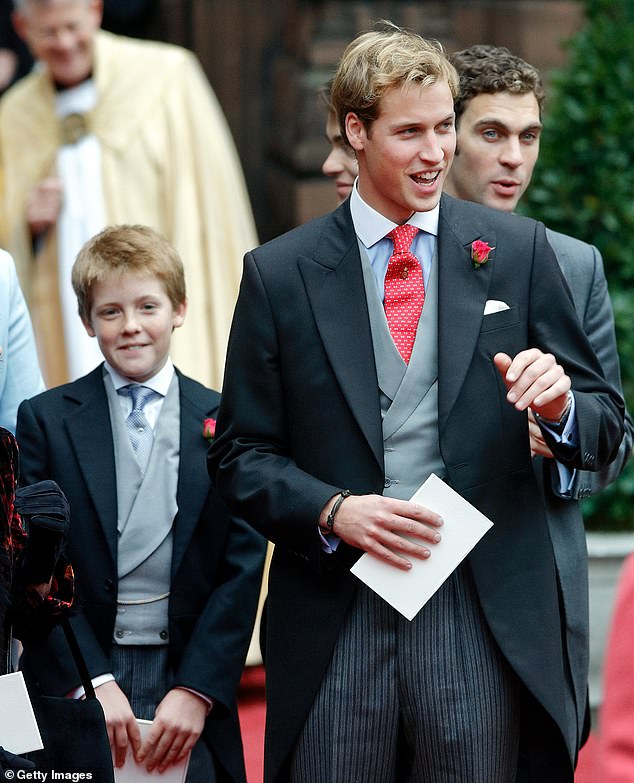 The 7th Duke, 33, as a young boy with a mischievous grin on his face next to lifelong friend William