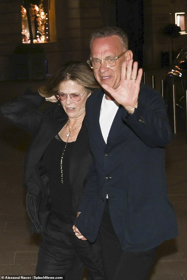 Tom, 67, looked dapper in a navy blue button-up blazer and white T-shirt as he held hands with Rita, 67