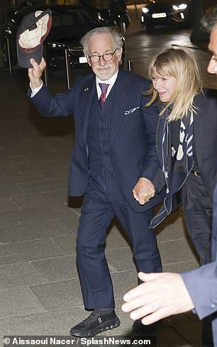 He added a colorful tie to his ensemble and held onto his baseball cap as he walked hand-in-hand with Kate, 70, who also wore a suit and scarf.