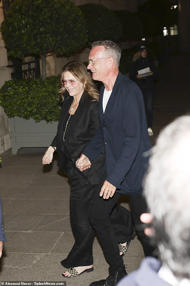 The couple looked in good spirits as they smiled as they walked back to the hotel