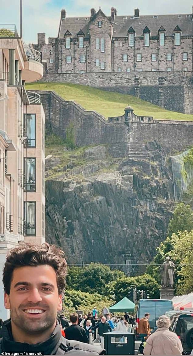 Jan Ravnik, one of Taylor's many backup dancers, was spotted taking a photo in front of Edinburgh Castle today