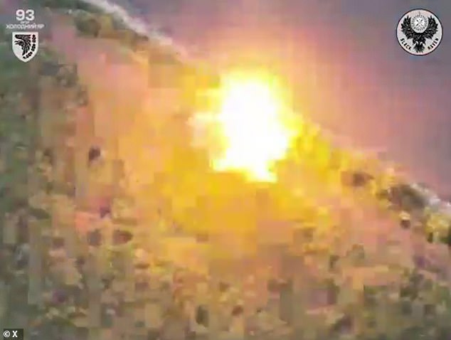 The tank explodes in a fireball after the drone slides in