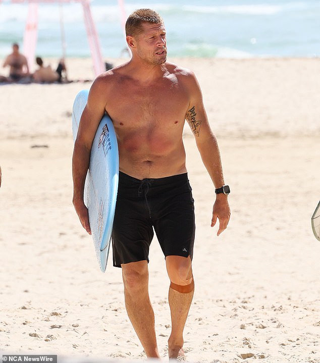 Australian surfing legend Mick Fanning (pictured) is pictured at a memorial for his brother Edward at the Greenmount Beach Surf Club on the Gold Coast on April 6, 2024