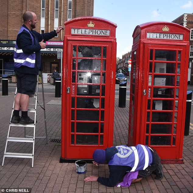 Workmen were seen repairing red telephone boxes in Chester city center ahead of the wedding