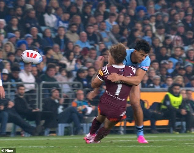 Sua'ali'i knocked out Walsh with the sickening goal (pictured) and was sent off - paving the way for Queensland's easy 38-10 win over the Blues on Wednesday night