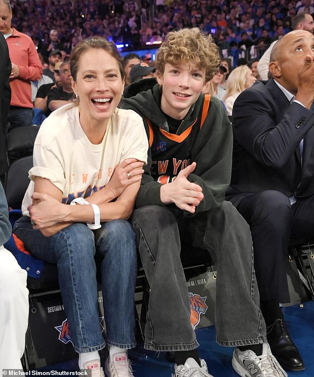 The cover model has been married to actor and director Ed Burns since 2003.  Turlington is pictured with her 18-year-old son Finn at a basketball game in April 2023.