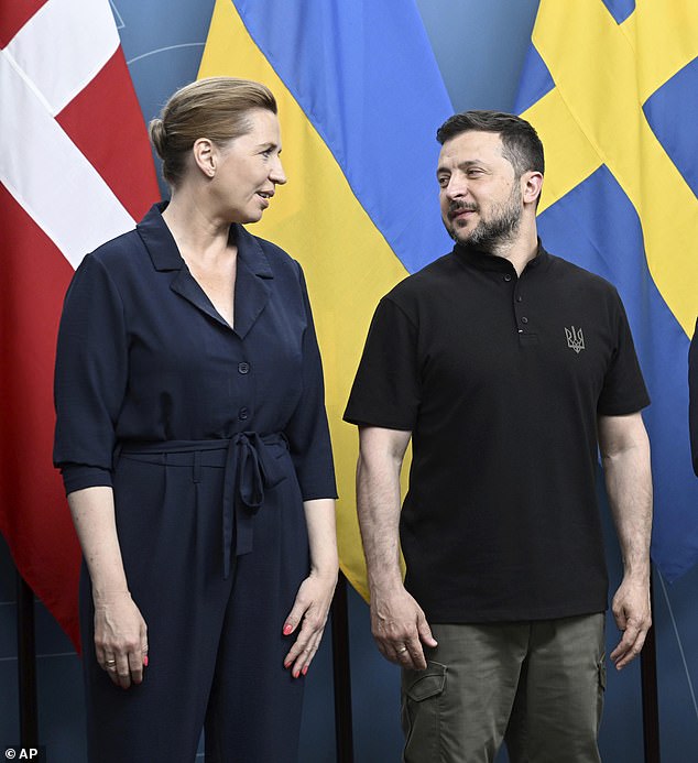 Danish Prime Minister Mette Frederiksen speaks with Ukrainian President Volodymyr Zelenskyy during a Nordic summit in Stockholm on Friday, May 31, 2024