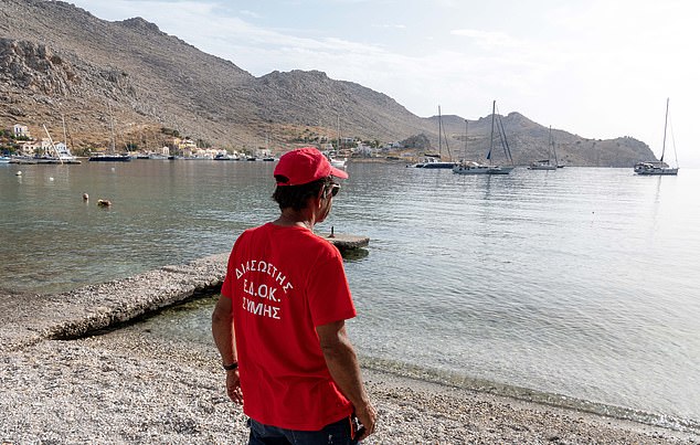 On June 7, workers arrive to continue the search at Pedi Beach on Symi Island