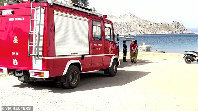 Firefighters stand up as they participate in searches for Dr.  Mosley on June 6