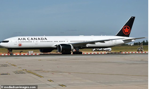 An Air Canada plane is pictured sitting on the runway