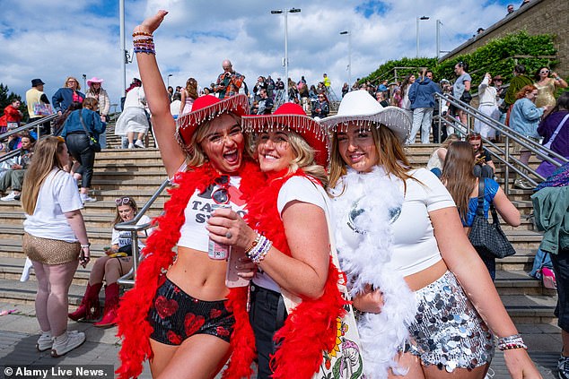 Sequins, cowboy hats and friendship bracelets are seen as a uniform for Swifties attending the show